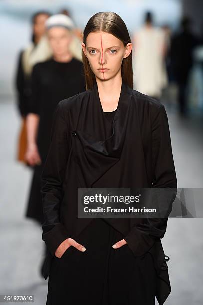 Models walk the runway at the Umasan show during the Mercedes-Benz Fashion Week Spring/Summer 2015 at Erika Hess Eisstadion on July 10, 2014 in...