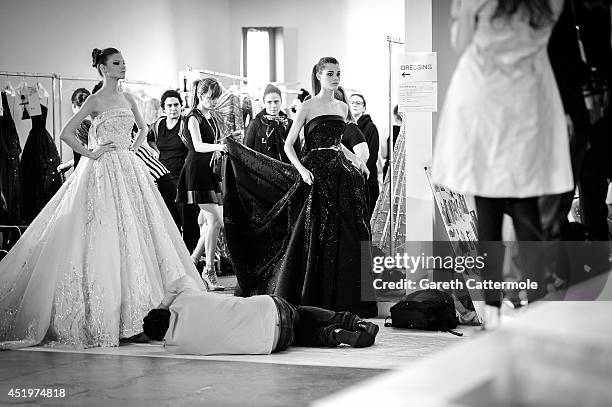 Model is helped with her dress backstage before the Zuhair Murad show as part of Paris Fashion Week - Haute Couture Fall/Winter 2014-2015 at Palais...