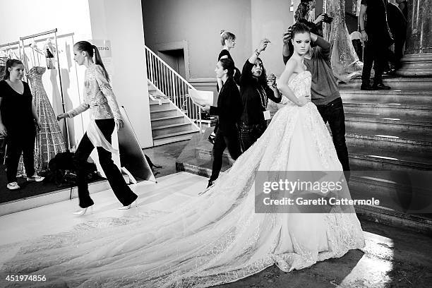 Model is helped with her dress backstage before the Zuhair Murad show as part of Paris Fashion Week - Haute Couture Fall/Winter 2014-2015 at Palais...