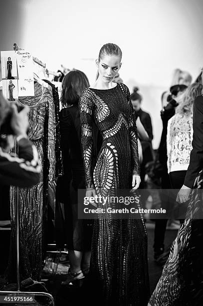 Model waits backstage before the Zuhair Murad show as part of Paris Fashion Week - Haute Couture Fall/Winter 2014-2015 at Palais Des Beaux Arts on...