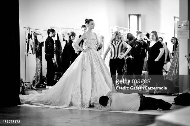 Model waits backstage before the Zuhair Murad show as part of Paris Fashion Week - Haute Couture Fall/Winter 2014-2015 at Palais Des Beaux Arts on...