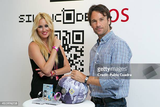 Carolina Cerezuela and Carlos Moya attend Omega Pharma Silincode SOS Charity Bracelet presentation on July 10, 2014 in Madrid, Spain.
