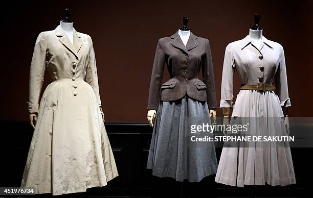 Three couture creations by fashion designers Jacques Fath, Jacques Heim and Christian Dior are displayed on July 10, 2014 at the Palais Galliera in...