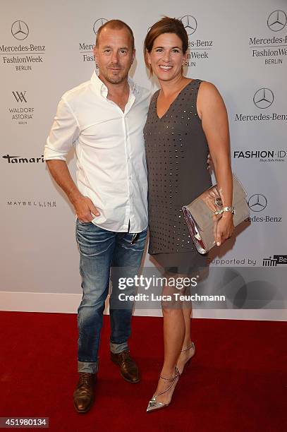 Heino Ferch and Marie-Jeanette Ferch attend the Laurel show during the Mercedes-Benz Fashion Week Spring/Summer 2015 at Erika Hess Eisstadion on July...