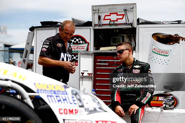 Gray Gaulding, driver of the Krispy Kreme Chevrolet stands in the garage area during practice for the Granite State 100 in the K&N Pro Series East at...