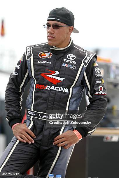 Jay Beasley, driver of the Toyota Racing Development Toyota stands in the garage area during practice for the Granite State 100 in the K&N Pro Series...