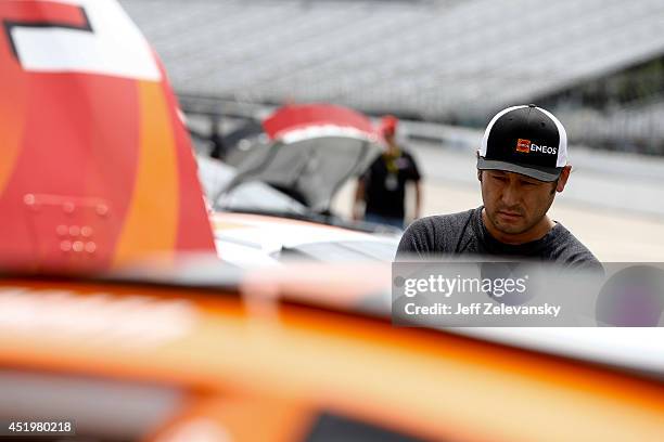 Akimori Ogata, driver of the ENEOS Toyota stands in the garage area during practice for the Granite State 100 in the K&N Pro Series East at New...