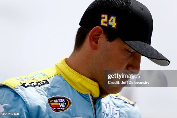 Brennan Newberry, driver of he Qore24 Chevrolet stands in the garage area during practice for the Granite State 100 in the K&N Pro Series East at New...