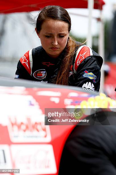 Kenzie Ruston, driver of the Ben Kennedy Racing Chevrolet stands in the garage area during practice for the Granite State 100 in the K&N Pro Series...