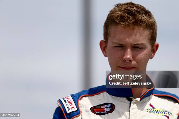 Matt Tifft, driver of the Federated Auto Parts Dodge stands in the garage area during practice for the Granite State 100 in the K&N Pro Series East...