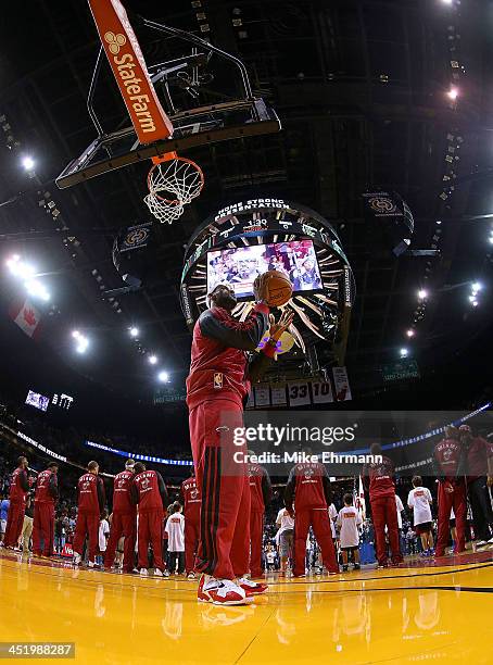 LeBron James of the Miami Heat warms up during a game against the Phoenix Suns at American Airlines Arena on November 25, 2013 in Miami, Florida.