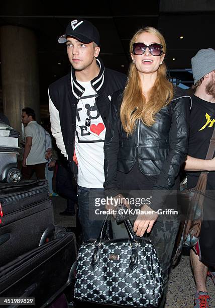 Paris Hilton and River Viiperi are seen arriving at LAX airport on November 25, 2013 in Los Angeles, California.