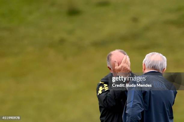 Luiz Felipe Scolari gestures with Jose Maria Marin the president of the Brazilian Football Confederation during a training session of the Brazilian...