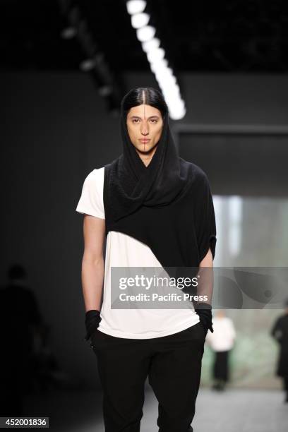 Amodel wears Umasan's collection during the Mercedes-Benz Fashion Week Berlin Spring/Summer 2015 at Erika Hess Eisstadion.