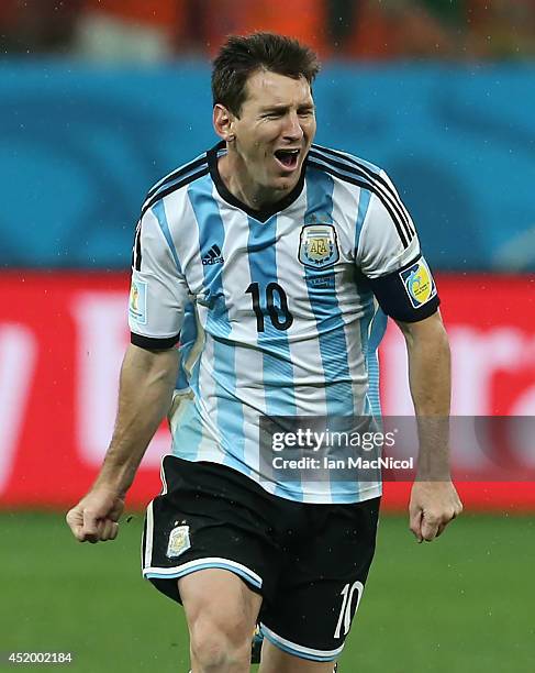 Lionel Messi of Argentina celebrates after a victory on penalties during the 2014 FIFA World Cup Brazil Semi Final match between Netherlands and...