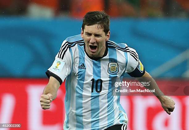 Lionel Messi of Argentina celebrates after a victory on penalties during the 2014 FIFA World Cup Brazil Semi Final match between Netherlands and...