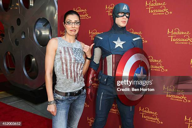 Model Adrianne Curry attends Madame Tussauds Hollywood grand opening party for the all new MARVEL 4D Theater Experience on July 10, 2014 in...