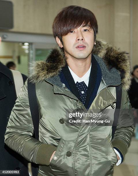 Know of South Korean boy band TVXQ is seen upon arrival at the Gimpo International Airport on November 25, 2013 in Seoul, South Korea.