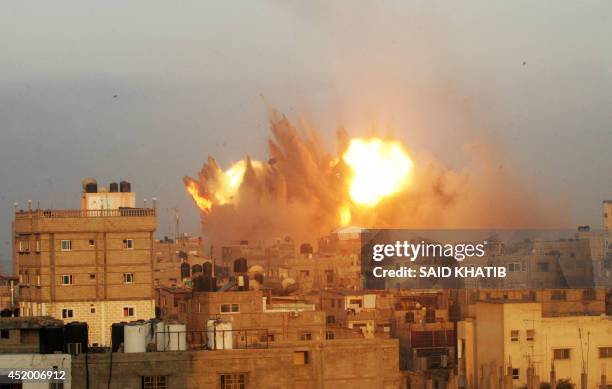 Ball of fire is seen following an early morning Israeli air strike, on July 11 on Rafah in the southern of Gaza strip. Israeli warplanes kept up...