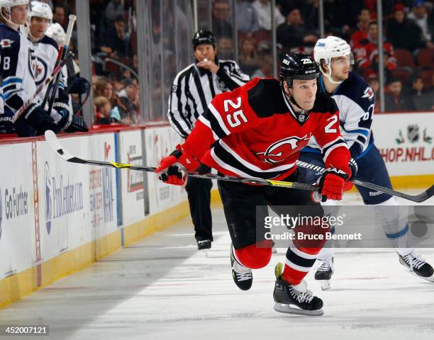 Cam Janssen of the New Jersey Devils skates against the Winnipeg Jets at the Prudential Center on November 25, 2013 in Newark, New Jersey. The Jets...