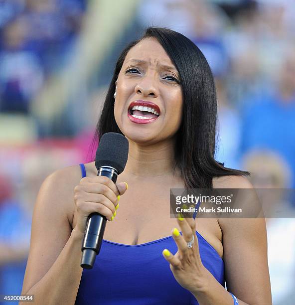 Singer Shelea Frazier sings the national anthem before the game between the San Diego Padres and Los Angeles Dodgers at Dodger Stadium on July 10,...
