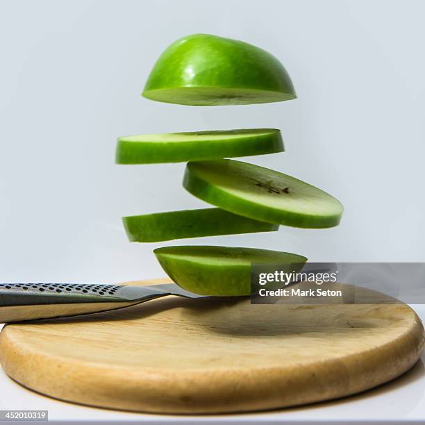 sliced fruit - green apple slices stock pictures, royalty-free photos & images