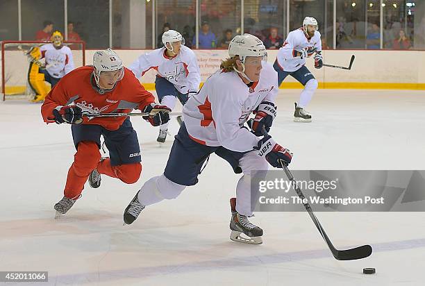 Miles Koules, right, heads down ice with Andre Burakovsky, left, giving chase during the intrasquad scrimmage at the Washington Capitals development...