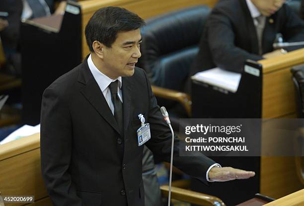 Thai opposition leader Abhisit Vejjajiva speaks during a no-confidence debate in the parliament in Bangkok on November 26, 2013. Thailand's premier...