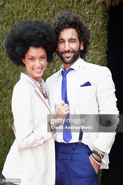 Rebecca Mir and Massimo Sinato arrive for the Miranda Konstantinidou show during the Mercedes-Benz Fashion Week Spring/Summer 2015 at Erika Hess...