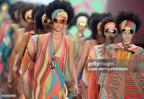 Models present fashion of the spring/summer 2015 collection by Greek-born designer Miranda Konstantinidou at the Mercedes-Benz Fashion Week in Berlin...