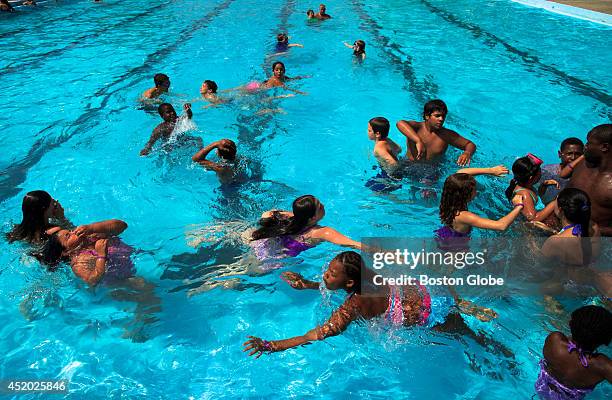 Kids from the Mystic Learning Center Summer Camp enjoyed the cool of the pool at Dilboy Pool in Somerville, Mass. On a hot afternoon, July 7, 2014.