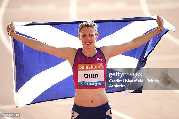 Eilidh Child of Great Britain poses with a Scottish flag after winning the Womens 400m hurdles during the IAAF Diamond League Day 1 at Hampden Park...