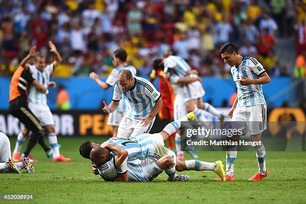 Argentina players celebrate victory after the 2014 FIFA World Cup Brazil Quarter Final match between Argentina and Belgium at Estadio Nacional on...