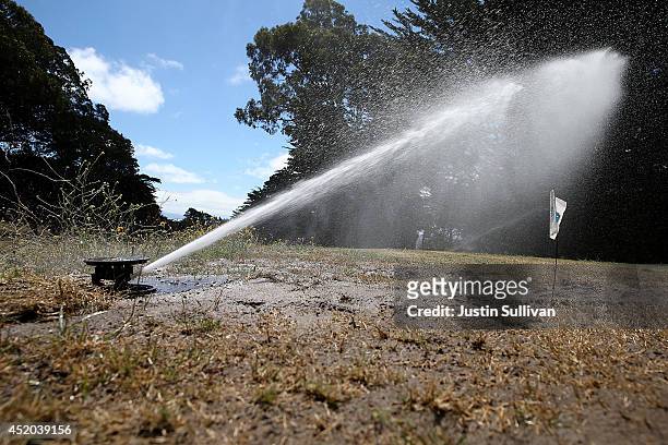 Tee box is watered by a sprinker at Gleneagles Golf Course on July 11, 2014 in San Francisco, California. As the severe drought in California...
