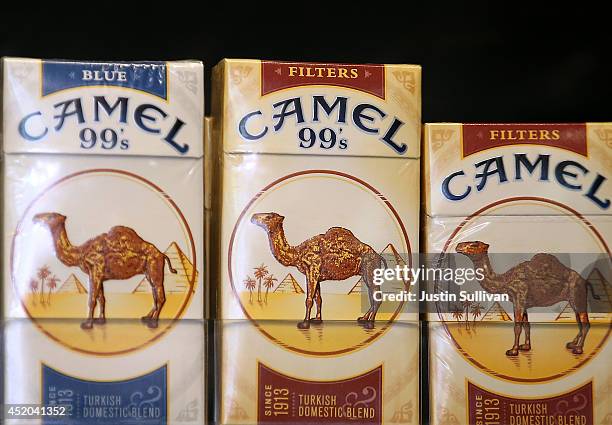 Camel cigarettes, manufactured by Reynolds Amercian, are displayed at a tobacco shop on July 11, 2014 in San Francisco, California. Tobacco giant...