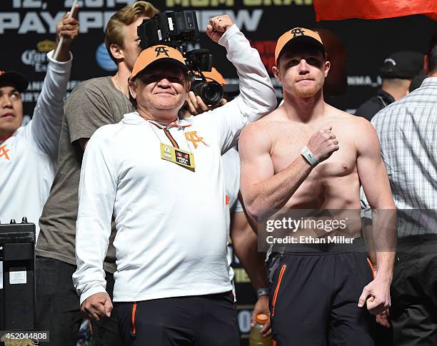 Trainer Jose "Chepo" Reynoso and boxer Canelo Alvarez pose during his official weigh-in at the MGM Grand Garden Arena on July 11, 2014 in Las Vegas,...