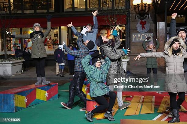 The cast of Broadway's Pippin rehearse for the 87th Annual Macy's Thanksgiving Day Parade at Macy's Herald Square on November 25, 2013 in New York...