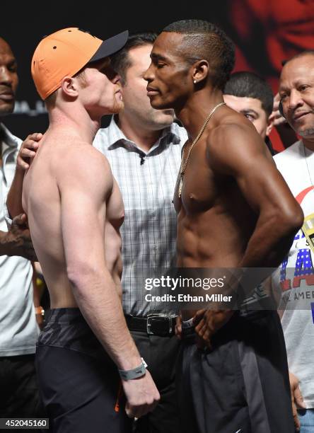 Boxers Canelo Alvarez and Erislandy Lara face off during their official weigh-in at the MGM Grand Garden Arena on July 11, 2014 in Las Vegas, Nevada....