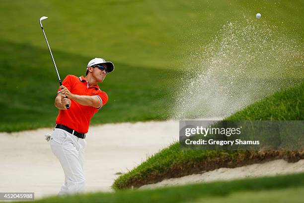 Scott Langley hits out of a bunker on the ninth hole during the second round of the John Deere Classic - Round Two held at TPC Deere Run on July 11,...