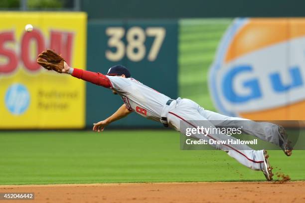 Danny Espinosa of the Washington Nationals dives for the ball in the second inning against the Philadelphia Phillies at Citizens Bank Park on July...