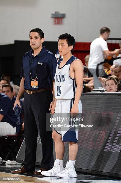 Assistant coach Kaleb Canales of the Dallas Mavericks speaks with Yuki Togashi against the New York Knicks at the Samsung NBA Summer League 2014 on...
