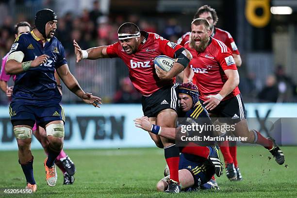 Nepo Laulala of the Crusaders is tackled during the round 19 Super Rugby match between the Crusaders and the Highlanders at AMI Stadium on July 12,...