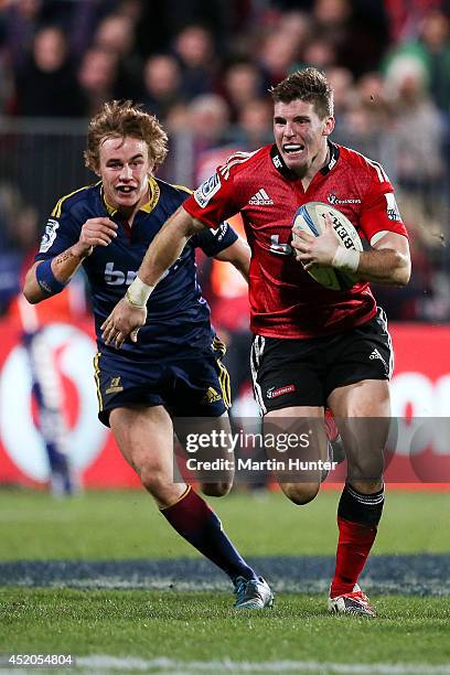 Colin Slade of the Crusaders makes a break during the round 19 Super Rugby match between the Crusaders and the Highlanders at AMI Stadium on July 12,...