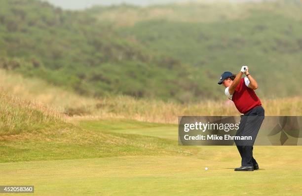 Phil Mickelson of the United States hits his approach shot on the first hole during the third round of the 2014 Aberdeen Asset Management Scottish...