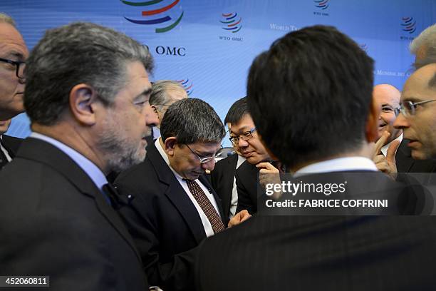 Diplomats negociate on November 26, 2013 before a general council meeting at the World Trade Organization in Geneva. World Trade Organization...