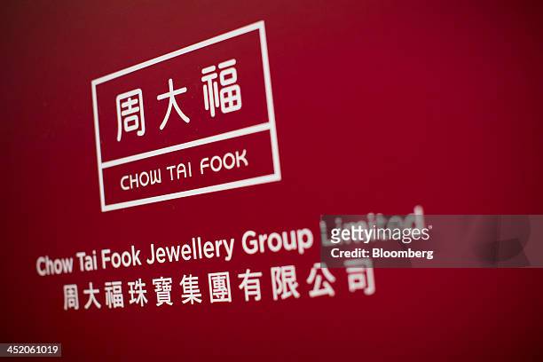 Signage for Chow Tai Fook Jewellery Group Ltd. Is displayed during a news conference in Hong Kong, China, on Tuesday, Nov. 26, 2013. Chow Tai Fook,...