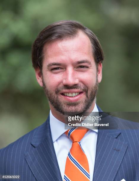 Hereditary Grand Duke Guillaume poses after the baptism ceremony of Princess Amalia at the Saint Ferreol Chapel in Lorgues on July 12, 2014 in...