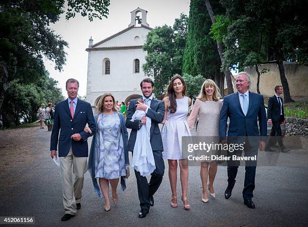 Grand Duke Henri and Grand Duchess Maria-Teresa of Luxembourg, pose with their son Prince Felix holding his daughter Princess Amalia, and his wife...