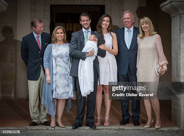 Grand Duke Henri and Grand Duchess Maria-Teresa of Luxembourg, pose with their son Prince Felix holding his daughter Princess Amalia, and his wife...