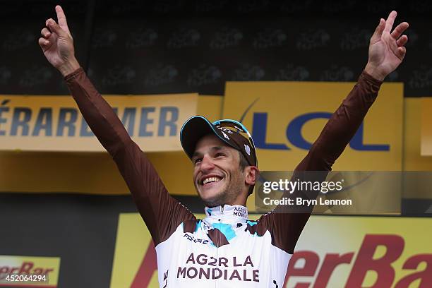 Stage winner Blel Kadri of France and AG2R La Mondiale celebrates on the podium after winning the eighth stage of the 2014 Tour de France, a 161km...